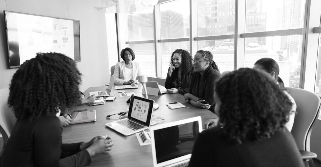 Black women collaborating in a modern office meeting. Engaging and productive work environment.